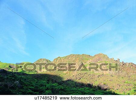 Stock Photo - nature, sky, cloud, mountain, grass, shadow. Fotosearch