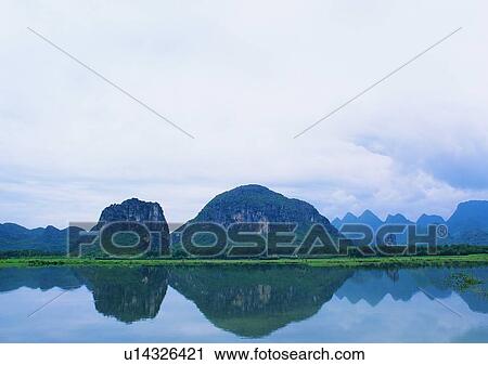 Stock Image - sky, grass, mountain, nature, cloud, lake. Fotosearch
