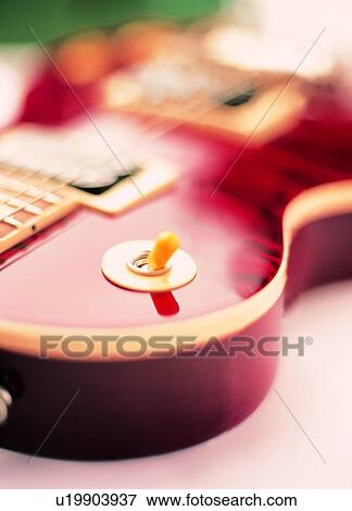 Stock Photo - Indoor, Entertainment, Guitar, Wooden, Instrument, Close-Up. Fotosearch