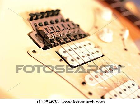 Stock Photo - Musical Instrument, Full Frame, Electric Guitar, White, Instrument, Indoor. Fotosearch