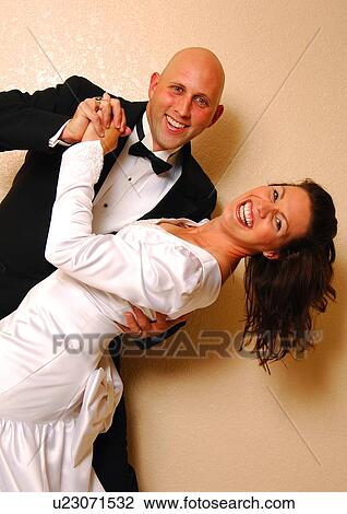 Stock Image - Portrait of a mid adult couple dancing. Fotosearch