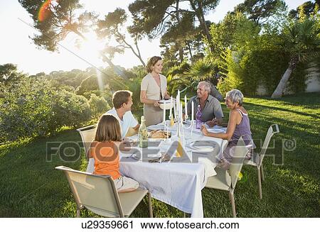 Family at an outdoor meal View Large Photo Image Stock Image - Family at an outdoor meal. Fotosearch