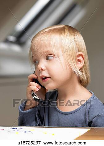 Little girl on the phone View Large Photo Image Stock Photo - Little girl on the phone. Fotosearch