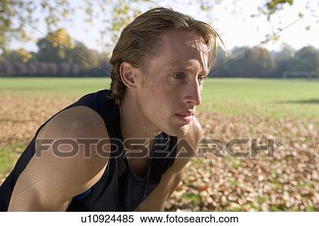 Stock Photography - Jogger resting recovering.. Fotosearch