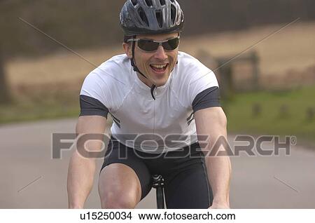 Man cycling in park View Large Photo Image Picture - Man cycling in park. Fotosearch