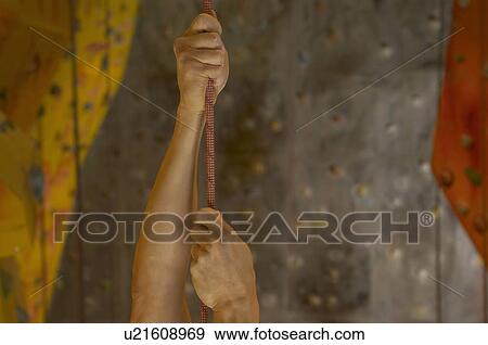 Man holding onto rope at indoor climbing centre, close-up View Large Photo Image Stock Photo - Man holding onto rope at indoor climbing centre, close-up. Fotosearch
