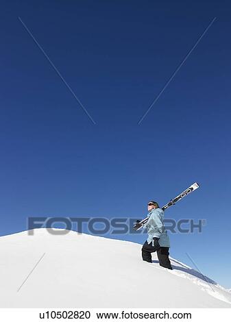 Skier climbing mountain View Large Photo Image Stock Image - Skier climbing mountain. Fotosearch
