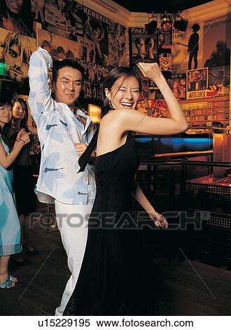 Stock Photography - Asian Ethnicity, Black Hair, Brown Hair, Bar, Amused. Fotosearch