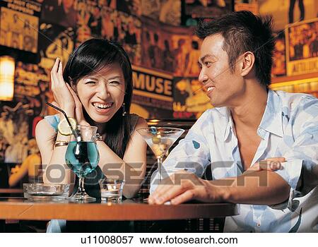 Stock Photo - Asian Ethnicity, Bracelet, Bar, Bangs, Affectionate. Fotosearch