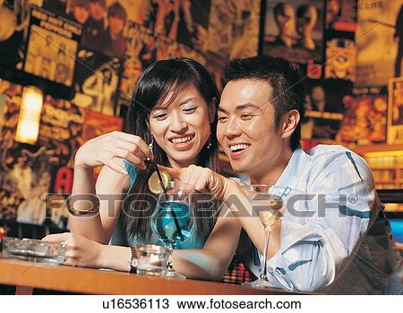 Stock Image - Bangs, Brown Hair, Bracelet, Bar, Asian Ethnicity. Fotosearch
