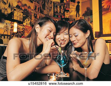 Stock Photograph - Bangs, Casual Clothing, Brown Hair, Bar, Asian Ethnicity. Fotosearch