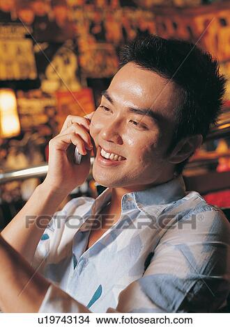 Picture - Bar, Chatting, Asian, Black Hair, Asian Ethnicity. Fotosearch