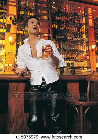 Bar Counter, Enjoyment, Open Collar, Indoor, Chair, Pant View Large Photo Image Stock Photo - Bar Counter, Enjoyment, Open Collar, Indoor, Chair, Pant. Fotosearch