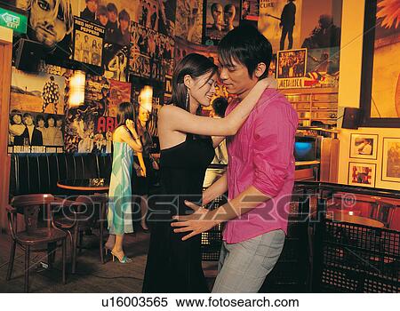 Stock Photography - Bar, Eyes Closed, Love, Togetherness, Cheerful, Young Women, Young Men. Fotosearch