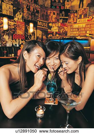 Black Hair, Earring, Indoor, Night Life, Asian, Drink, People In The Background View Large Photo Image Stock Image - Black Hair, Earring, Indoor, Night Life, Asian, Drink, People In The Background. Fotosearch