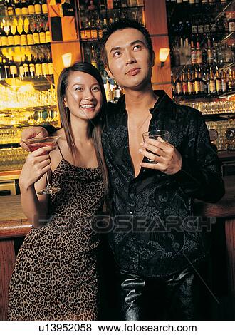 Brown Hair, Young Couple, Bar, Lifestyles, Togetherness, Evening Wear View Large Photo Image Stock Photo - Brown Hair, Young Couple, Bar, Lifestyles, Togetherness, Evening Wear. Fotosearch