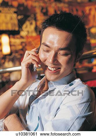 Cheerful, Looking Down, Casual Clothing, Happiness, Asian Ethnicity, Single Man, Open Collar View Large Photo Image Stock Image - Cheerful, Looking Down, Casual Clothing, Happiness, Asian Ethnicity, Single Man, Open Collar. Fotosearch
