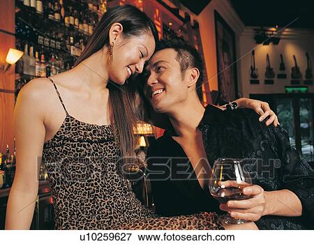 Stock Photo - Smiling, Flirting, Cheerful, Open Collar, Close-Up, Lifestyles. Fotosearch