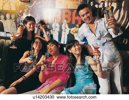 Stock Image - Toothy Smile, Looking Sideways, Friend, Japanese Ethnicity, Holding, Pant. Fotosearch