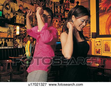 Stock Photo - Waist-Up, Young Women, Black Hair, Evening Wear, Asian Ethnicity, Young Adult, Standing. Fotosearch