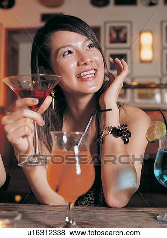 Young Adult, Toothy Smile, Drinking, Stem Glass, Asian Ethnicity, Asian, Table View Large Photo Image Stock Photo - Young Adult, Toothy Smile, Drinking, Stem Glass, Asian Ethnicity, Asian, Table. Fotosearch