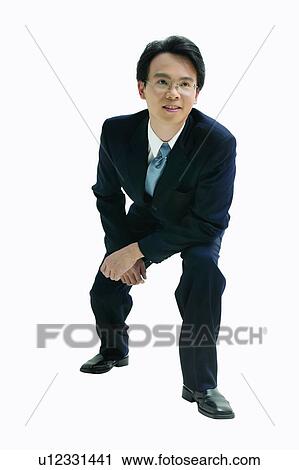 Bending, Businessman, Crouching, Asian Ethnicity, Clipping Path, Cut Out, Formal Clothing View Large Photo Image Stock Image - Bending, Businessman, Crouching, Asian Ethnicity, Clipping Path, Cut Out, Formal Clothing. Fotosearch
