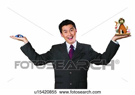 Stock Photography - Black Hair, Model Home, Indoor, Waist-Up, Business Suit, Anticipation. Fotosearch