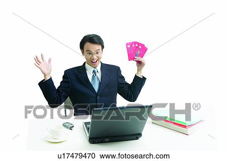 Stock Image - Businessman, Communication, Clipping Path, Laptop, Asian Ethnicity, One Person, Cut Out. Fotosearch