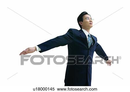 Stock Photography - Clipping Path, Asian Ethnicity, Businessman, Business Suit, Black Hair, Arm Outstretched. Fotosearch