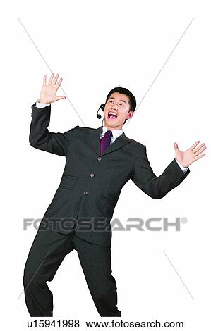 Stock Photo - Clipping Path, Bending, Cheerful, Businessman, Business Suit, Asian Ethnicity. Fotosearch
