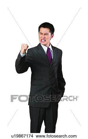 Picture - Clipping Path, Black Hair, Clenching Teeth, Businessman, Business Suit, Asian Ethnicity. Fotosearch