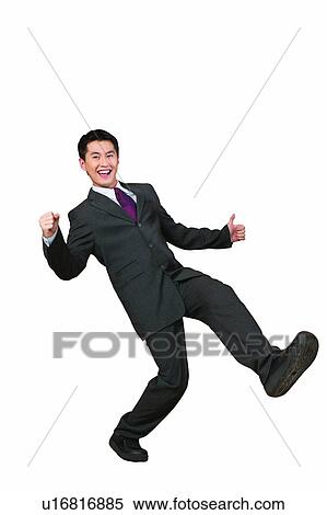 Stock Photography - Formal Clothing, Businessman, Standing On One Leg, Excitement, Thumbs Up, Human Thumb. Fotosearch