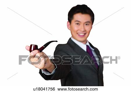 Stock Photograph - Leisure Activity, Smoking Issues, Black Hair, Office, Close-Up, Shirt And Tie. Fotosearch