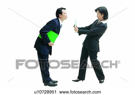 Stock Image - Looking At Each Other, Indoor, Playful, Clipping Path, Business Suit, File. Fotosearch