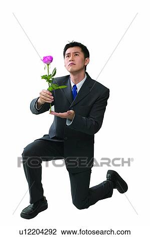Uncertainty, Kneeling, Asian Ethnicity, Business Suit, Holding, Eastern View Large Photo Image Stock Image - Uncertainty, Kneeling, Asian Ethnicity, Business Suit, Holding, Eastern. Fotosearch