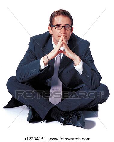 Stock Image - crossed legs, businessman, clipping path, emotion, business executive, career. Fotosearch
