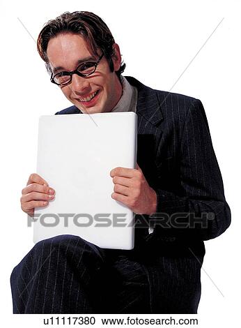 Stock Image - human cutouts, computer, happy, looking at camera, business executive, professional. Fotosearch