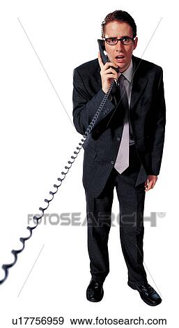 Stock Photo - white background, standing, one person, young adult, communication, landline phone. Fotosearch