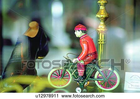 Stock Image - decoration, riding, life, bike, doll, shoe. Fotosearch