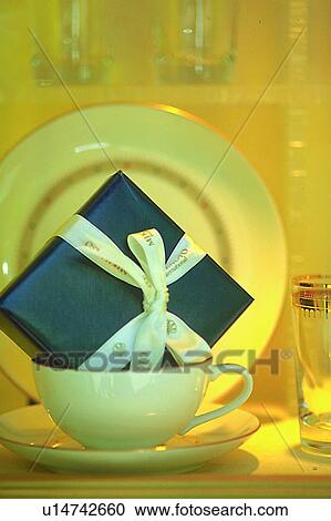 Stock Image - life, saucer, object, ribbon, tableware, plate. Fotosearch