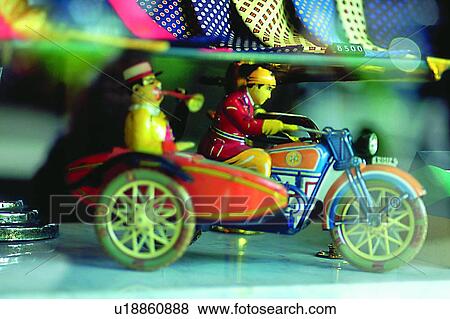 Stock Photo - object, decoration, life, motorcycle, doll, riding. Fotosearch