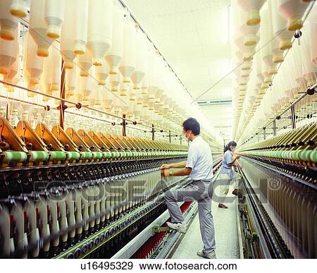 Stock Photo - Casual Clothing, Industrial Equipment, Two People, Manufacturing Equipment, Shoe, Thread. Fotosearch