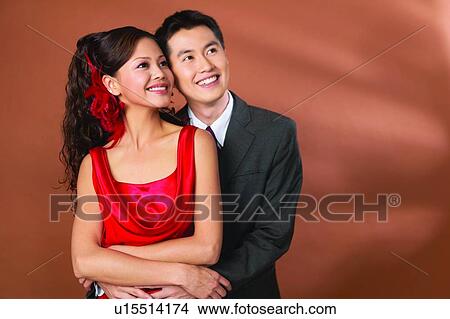 Affectionate, Black Hair, Asian Ethnicity, Arms Crossed, Adults Only View Large Photo Image Picture - Affectionate, Black Hair, Asian Ethnicity, Arms Crossed, Adults Only. Fotosearch