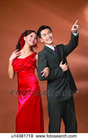 Stock Photo - Affectionate, Black Hair, Asian Ethnicity, Arm In Arm, Adults Only. Fotosearch