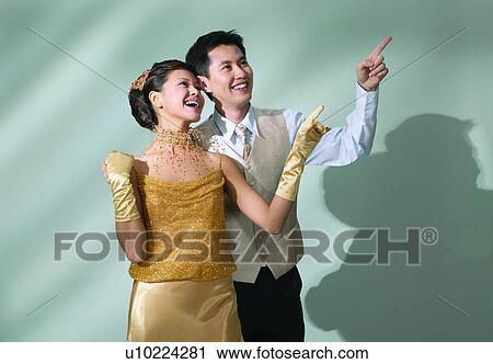 Stock Image - Affectionate, Black Hair, Behind, Asian Ethnicity, Adults Only. Fotosearch