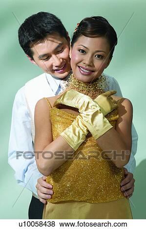 Stock Photo - Affectionate, Black Hair, Behind, Asian Ethnicity, Adults Only. Fotosearch