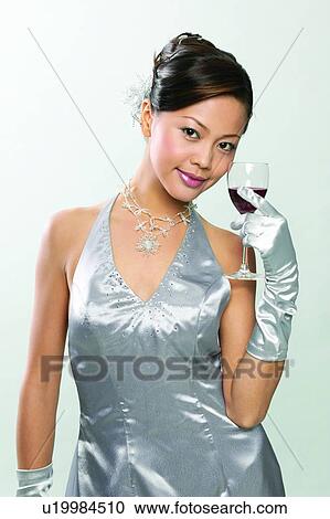 Stock Image - Alcoholism, Black Hair, Beverage, Asian Ethnicity, Alcohol. Fotosearch