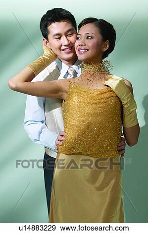 Stock Photo - Beautiful, Button Down Shirt, Formal Clothing, Lifestyles, Well-Dressed, Posing, Evening Wear. Fotosearch