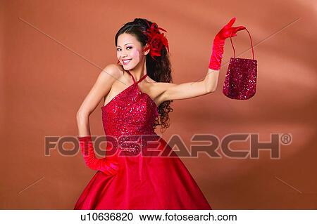 Stock Image - Black Hair, Colored Background, Brown, Asian Ethnicity. Fotosearch