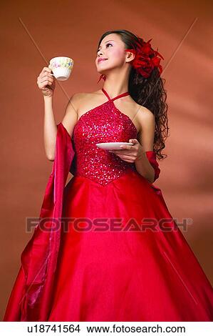 Black Hair, Cup, Colored Background, Asian Ethnicity View Large Photo Image Picture - Black Hair, Cup, Colored Background, Asian Ethnicity. Fotosearch